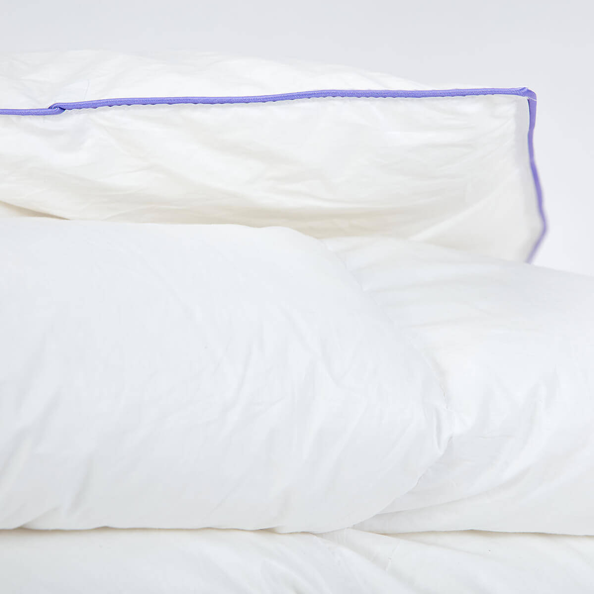 Luxury Austrian goose down duvet with purple piping detailing.