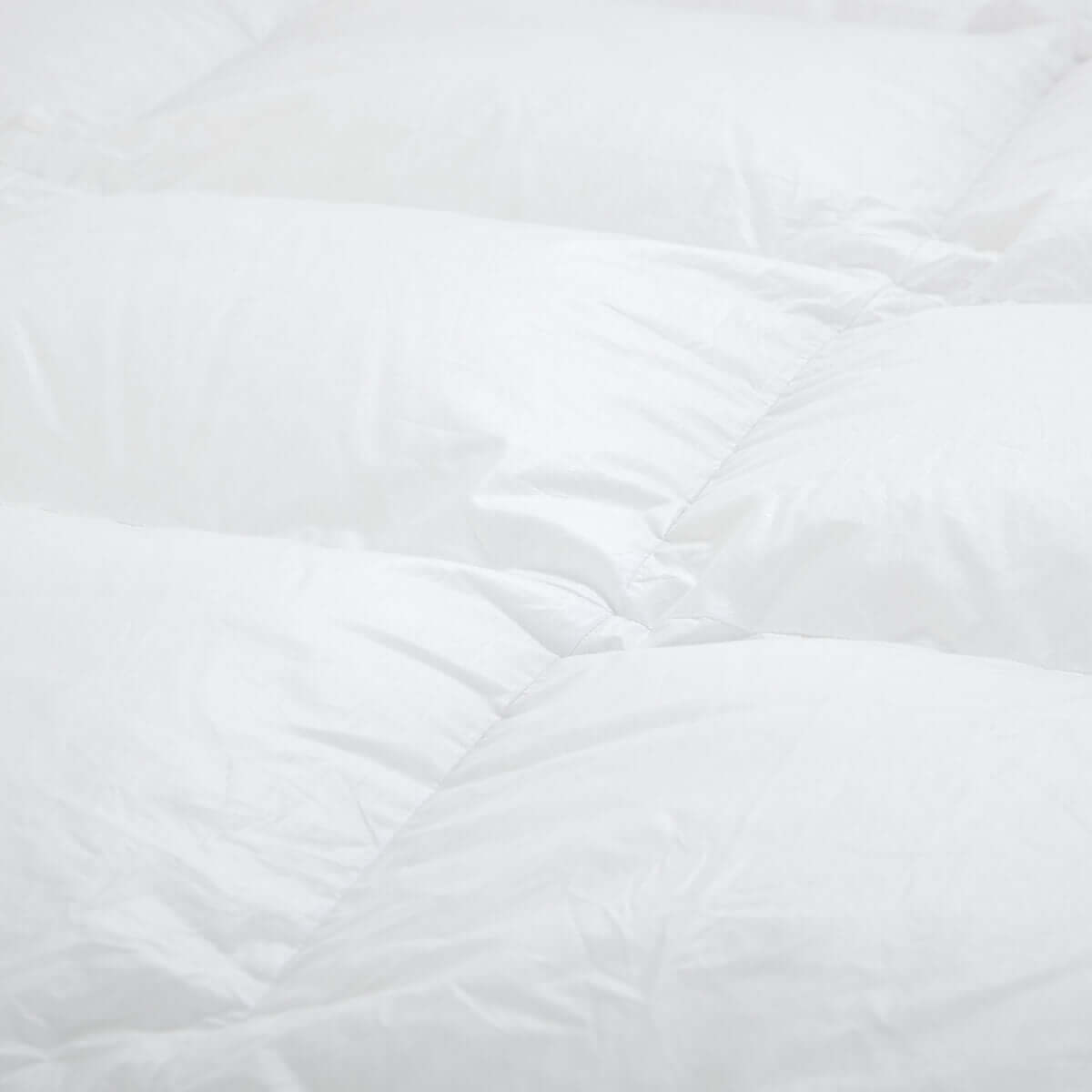 Luxurious white down comforter with premium Austrian goose down filling for ultimate warmth and comfort.